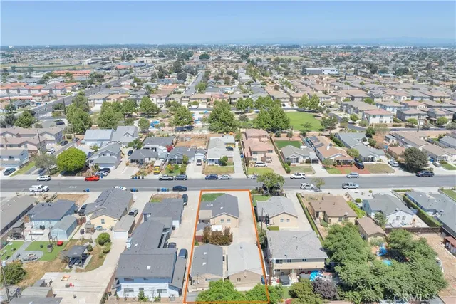 an aerial view of a house with a yard
