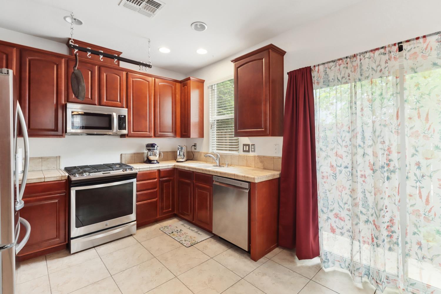 2012 Muscovy Road West Sacramento, CA 95691 - Photo 15 of 42 a kitchen with stainless steel appliances granite countertop a stove top oven a sink and dishwasher