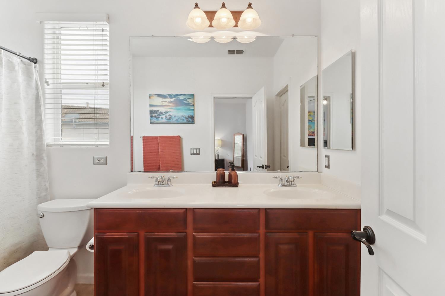 2012 Muscovy Road West Sacramento, CA 95691 - Photo 21 of 42 a bathroom with a double vanity sink mirror and toilet