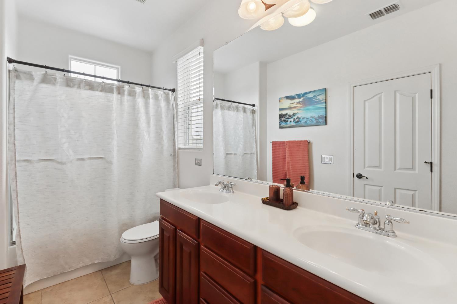 2012 Muscovy Road West Sacramento, CA 95691 - Photo 22 of 42 a bathroom with double vanity sink a mirror and shower
