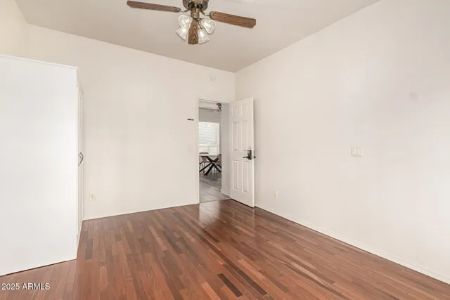 a view of a room with wooden floor