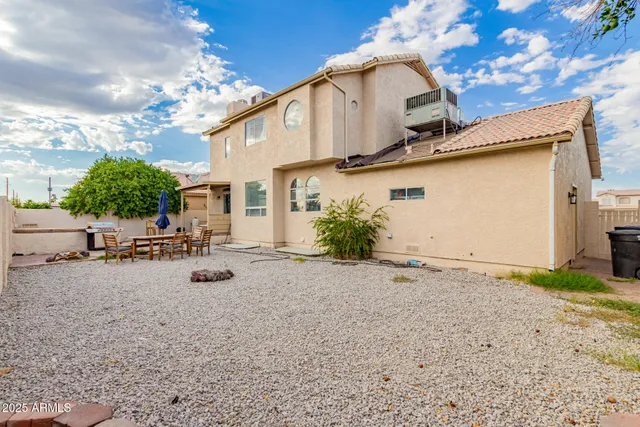 a view of a patio with swimming pool table and chairs