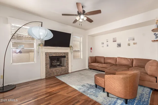 a living room with furniture and a fireplace