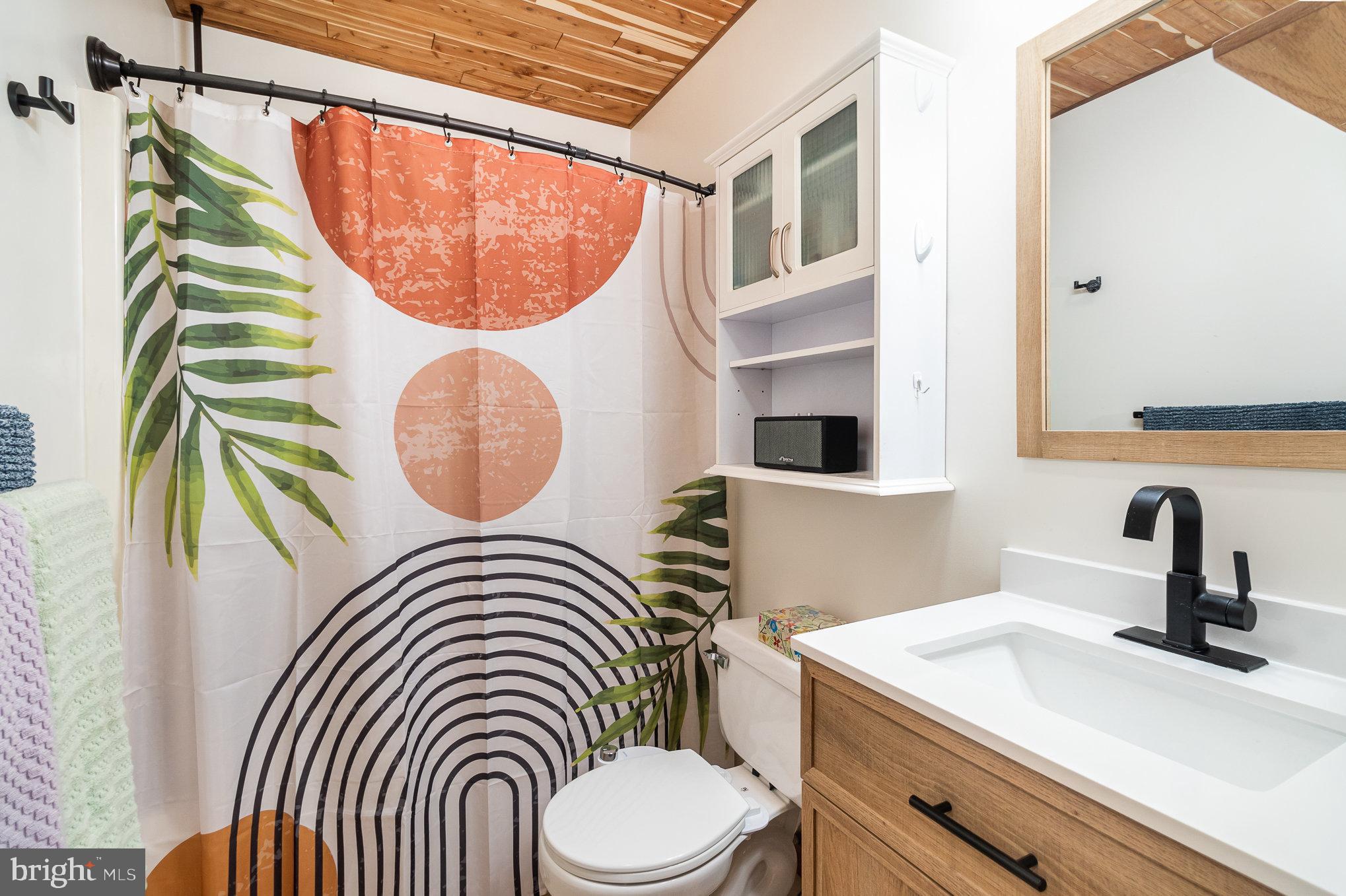 48 Tory Circle Enola, PA 17025 - Photo 17 of 26 a bathroom with a sink a mirror and a toilet