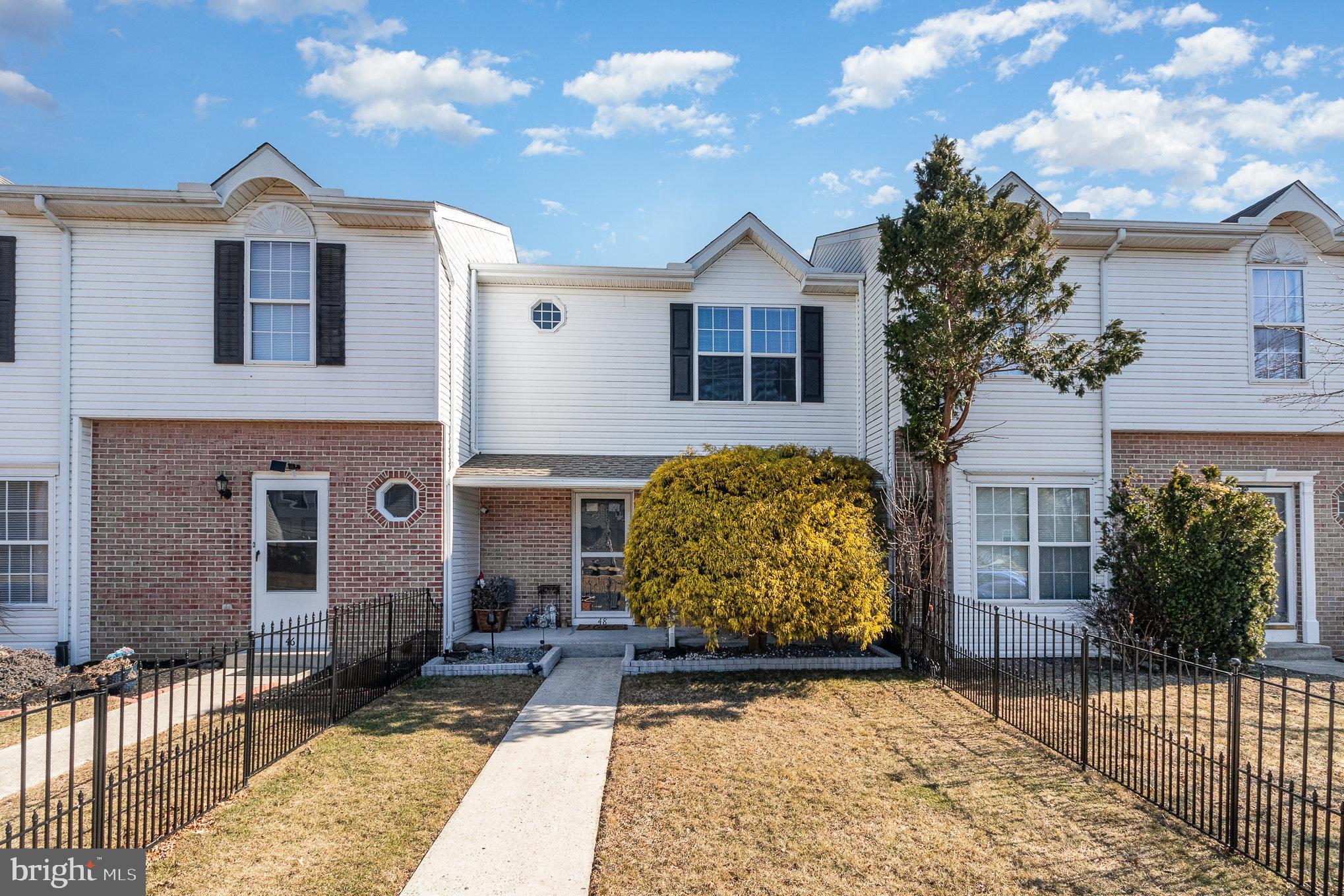 48 Tory Circle Enola, PA 17025 - Photo 26 of 26 a view of a brick house with many windows next to a yard