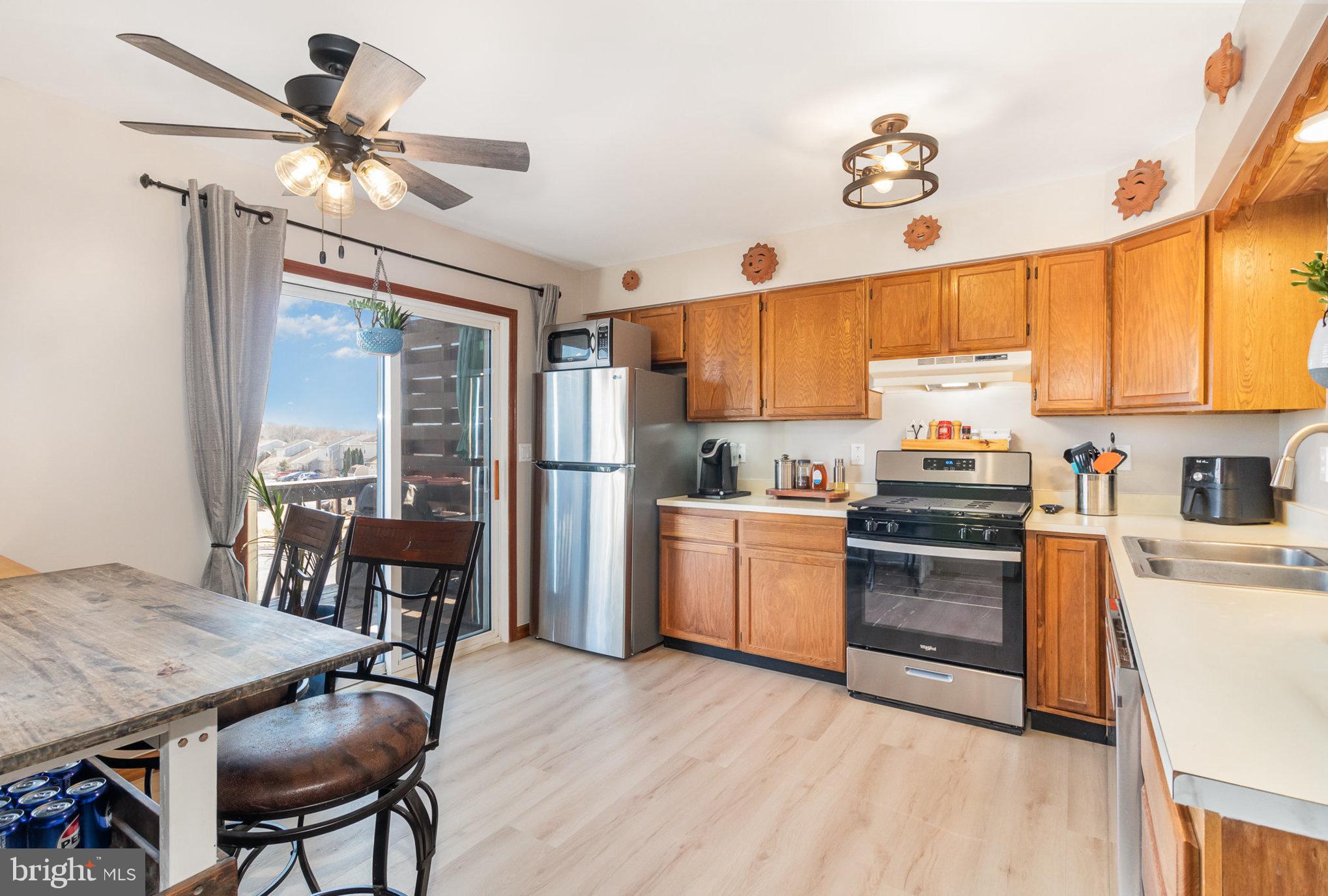 48 Tory Circle Enola, PA 17025 - Photo 6 of 26 a kitchen with granite countertop cabinets stainless steel appliances and a dining table