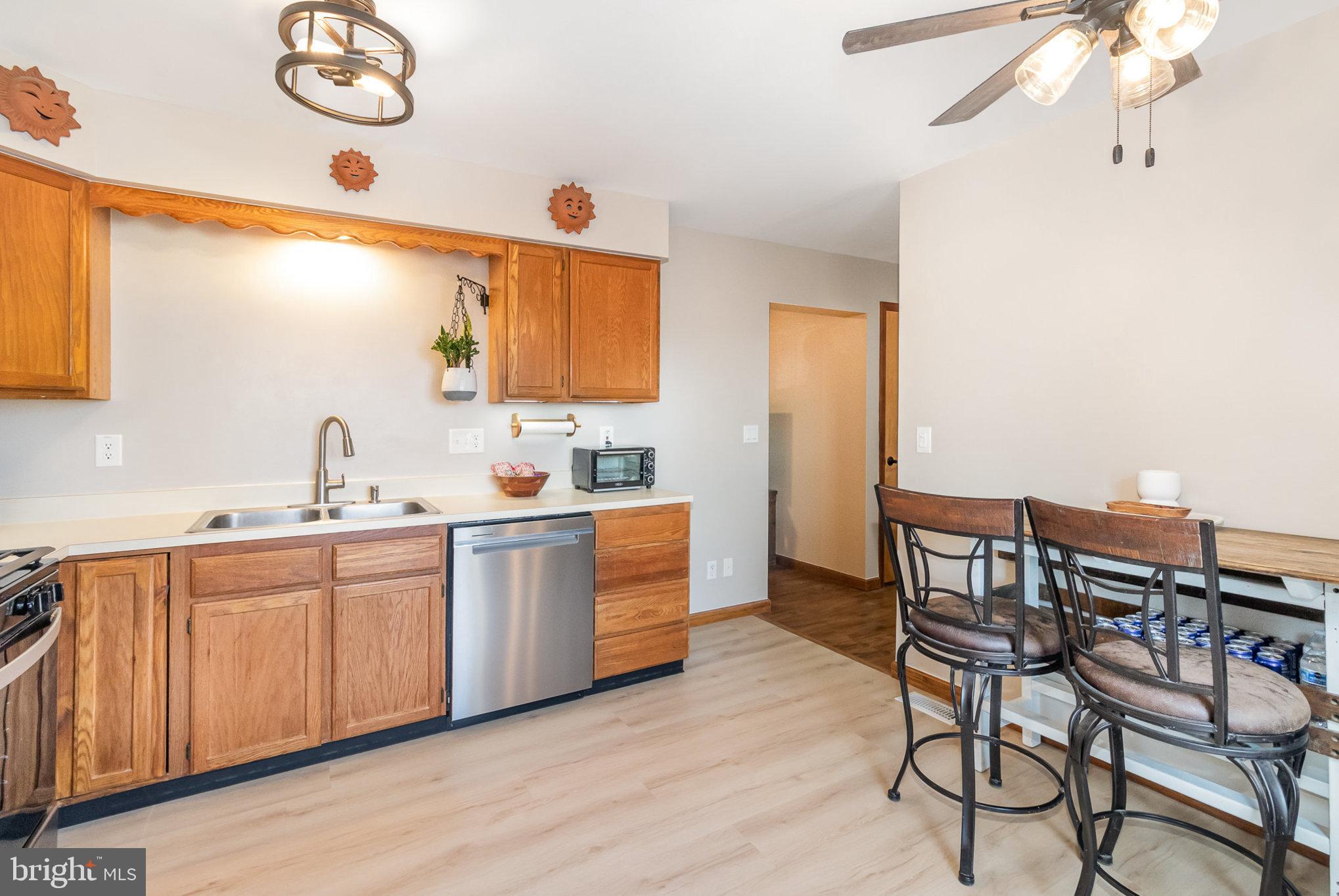 48 Tory Circle Enola, PA 17025 - Photo 7 of 26 a kitchen with a table chairs sink and cabinets