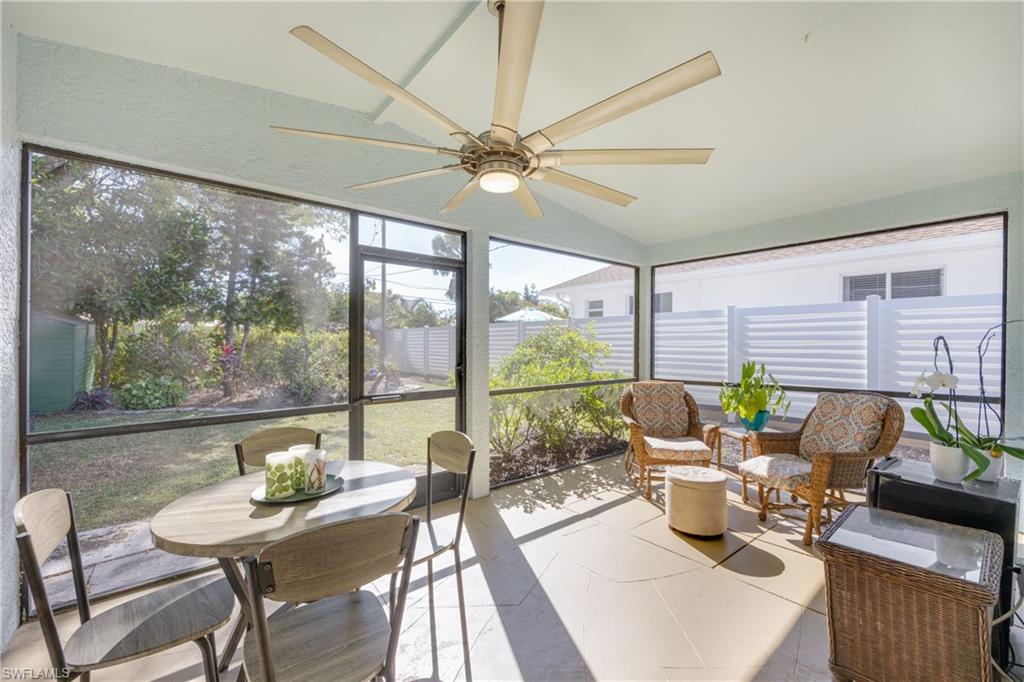 736 92nd Avenue North Naples, FL 34108 - Photo 13 of 25 a living room with furniture and a large window