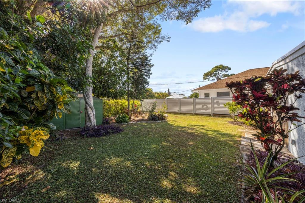 736 92nd Avenue North Naples, FL 34108 - Photo 23 of 25 a backyard of a house with lots of green space
