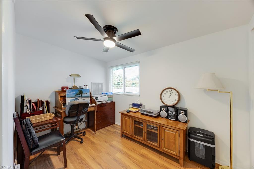 736 92nd Avenue North Naples, FL 34108 - Photo 3 of 25 a view of a workspace with furniture and a window