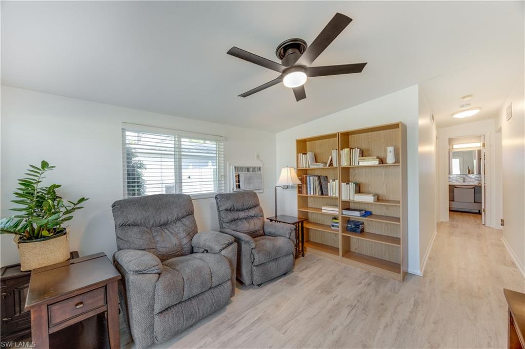 736 92nd Avenue North Naples, FL 34108 - Photo 5 of 25 a living room with furniture and a large window