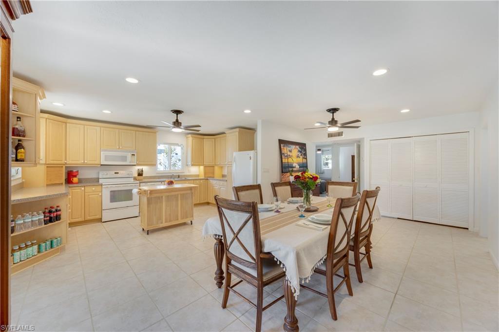 736 92nd Avenue North Naples, FL 34108 - Photo 8 of 25 a view of a dining area with furniture and kitchen view