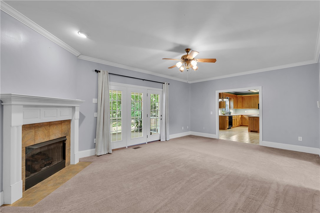 406 Hopewell Ridge Anderson, SC 29621 - Photo 15 of 46 This inviting living space features a cozy fireplace and convenient access to an outdoor area.