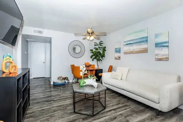 a living room with furniture and a flat screen tv