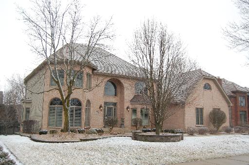 2724 Wendy Road Naperville, IL 60565 - Photo 1 of 16 a front view of a house with snow
