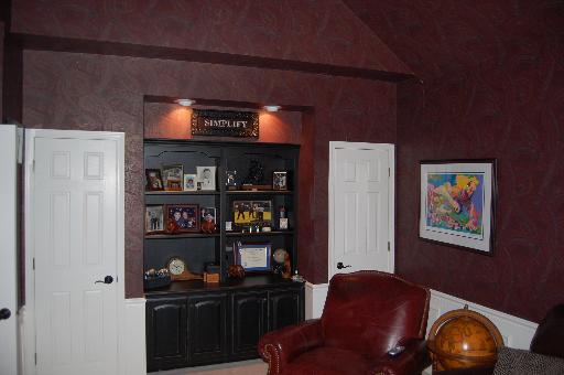 2724 Wendy Road Naperville, IL 60565 - Photo 12 of 16 a livingroom with bookshelf and a workspace