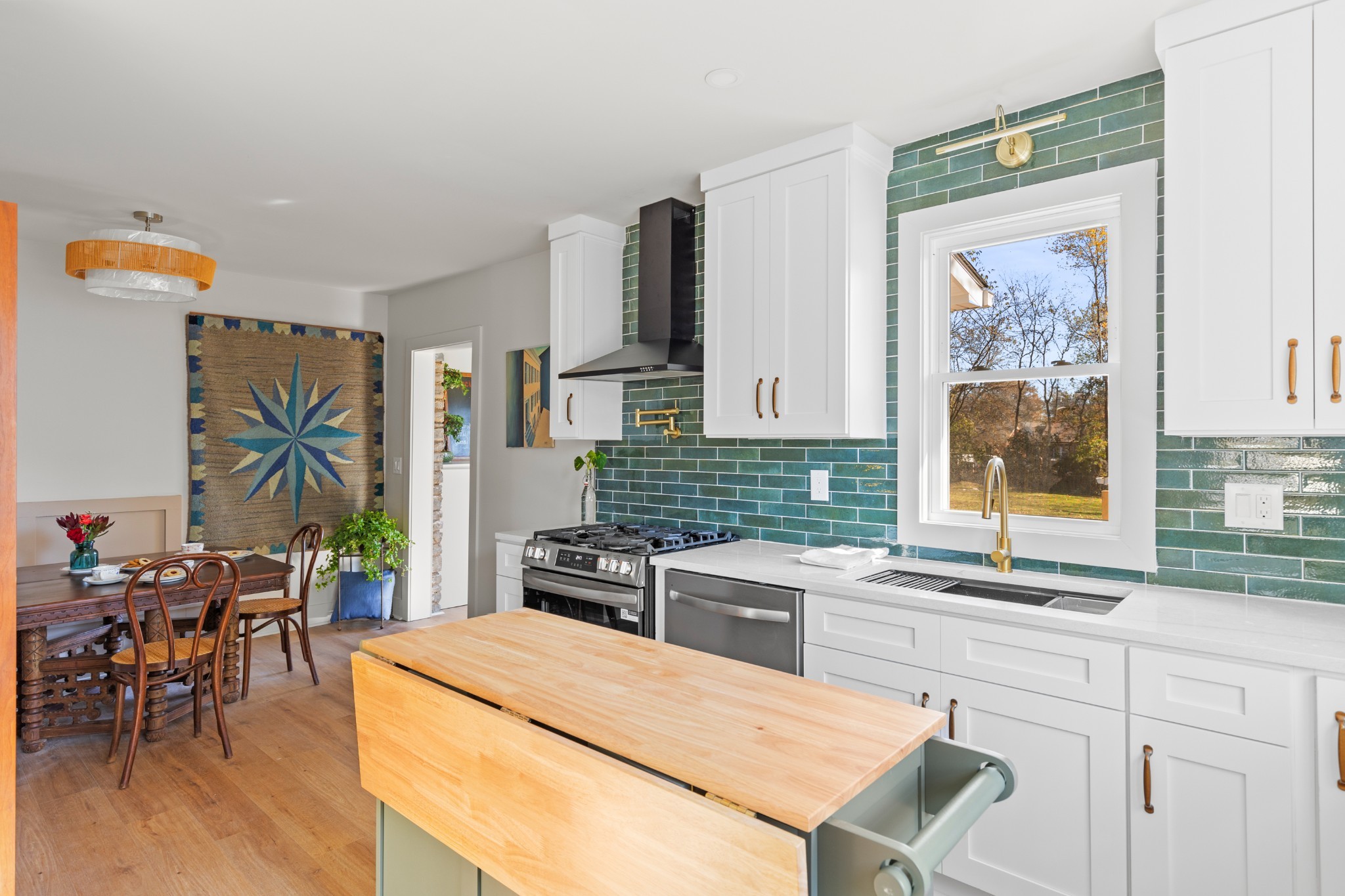 827 Argle Avenue Madison, TN 37115 - Photo 7 of 35 a kitchen with stainless steel appliances kitchen island granite countertop a stove a refrigerator and a dining table with granite countertop