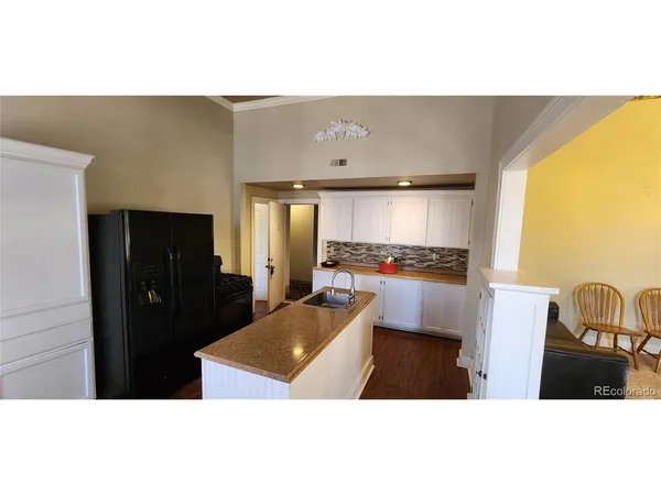 a front view of a building with a yard