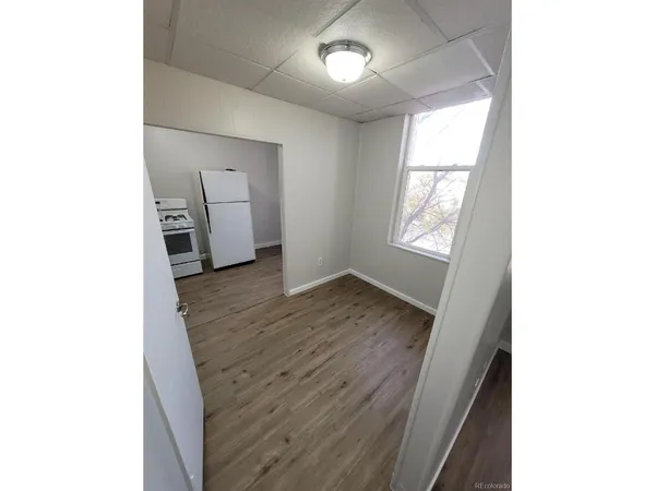 a bathroom with a toilet a sink a shower and vanity