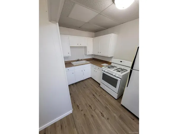 a view of a kitchen from the hallway