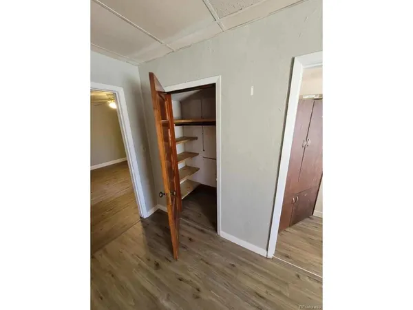 a bathroom with a sink and mirror with toilet