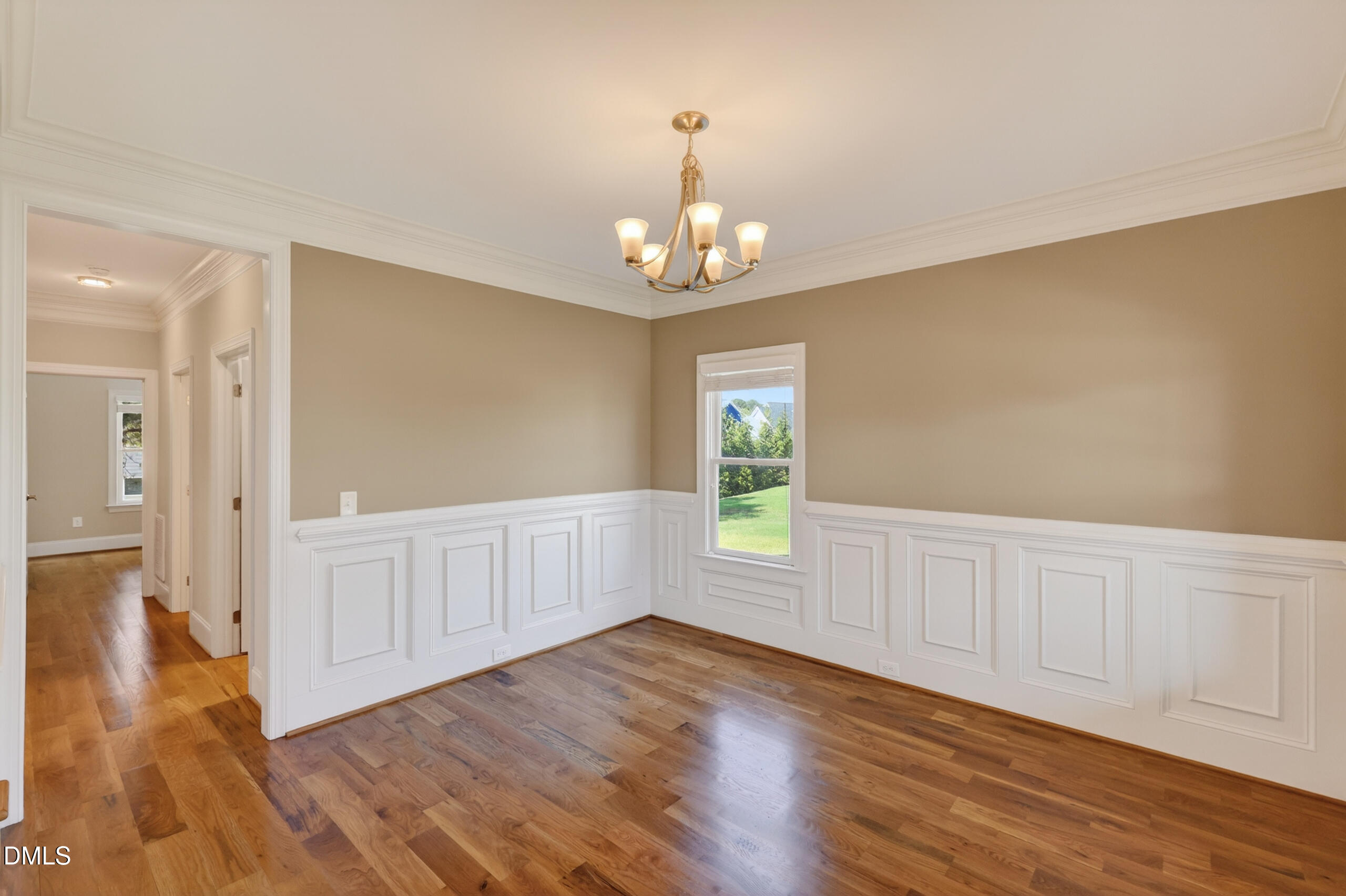 261 Character Drive Rolesville, NC 27571 - Photo 12 of 77 a view of an empty room with wooden floor and a window