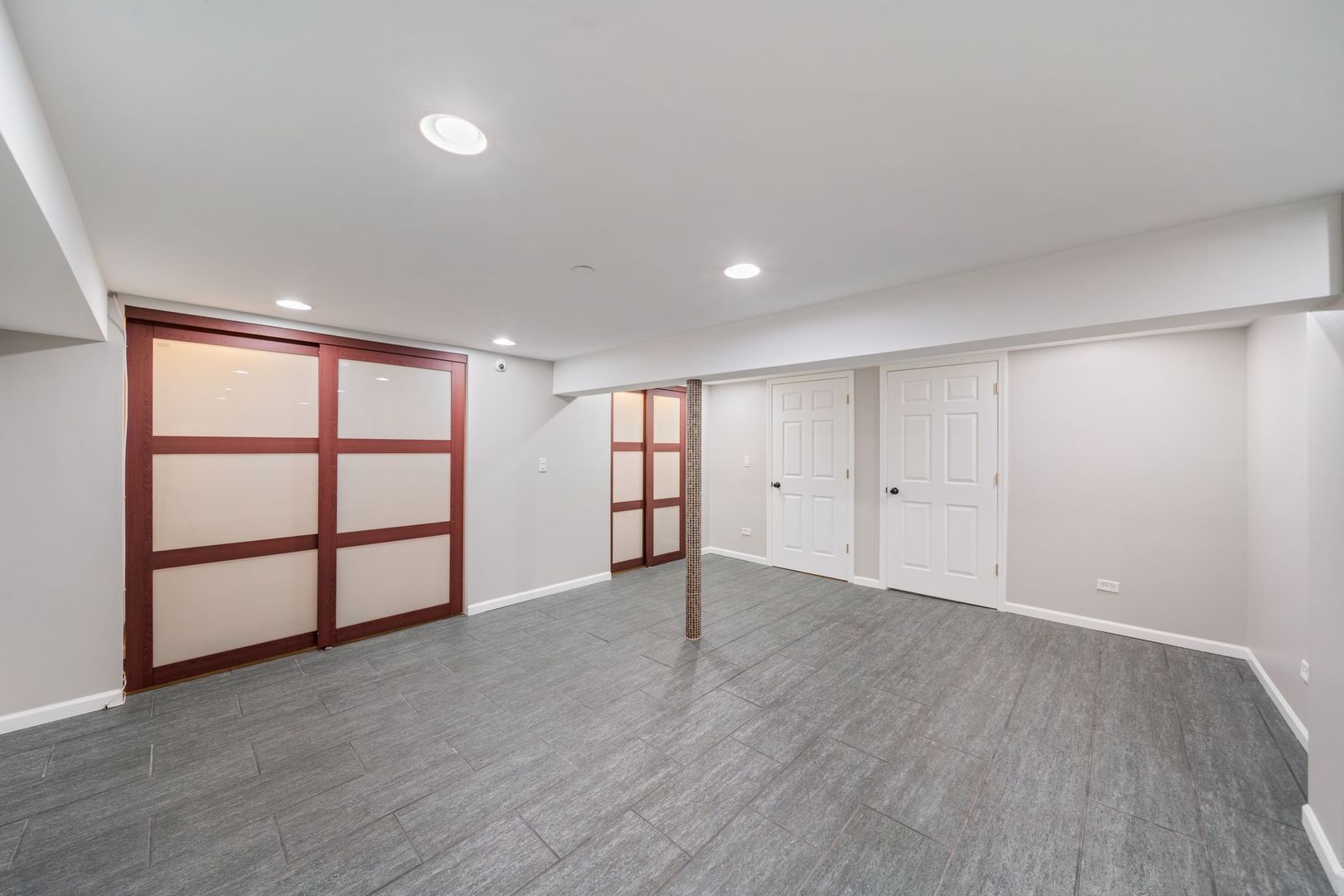 701 Oakton Street Park Ridge, IL 60068 - Photo 45 of 59 a view of an empty room with wooden floor and a window