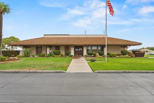 a view of swimming pool in front of house