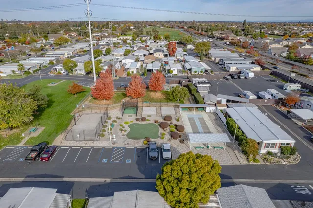 an aerial view of residential houses with outdoor space