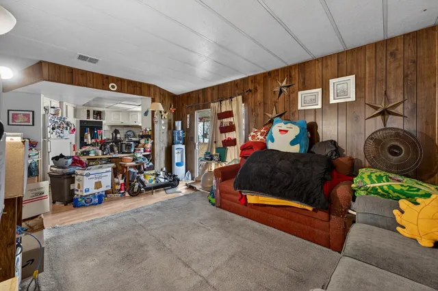 a bedroom with bed and a walk in closet