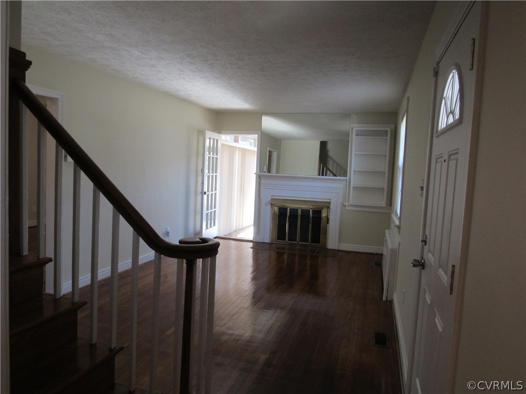 5313 Coxson Road Sandston, VA 23150 - Photo 8 of 27 Living room with wood floors, wood burning firepla