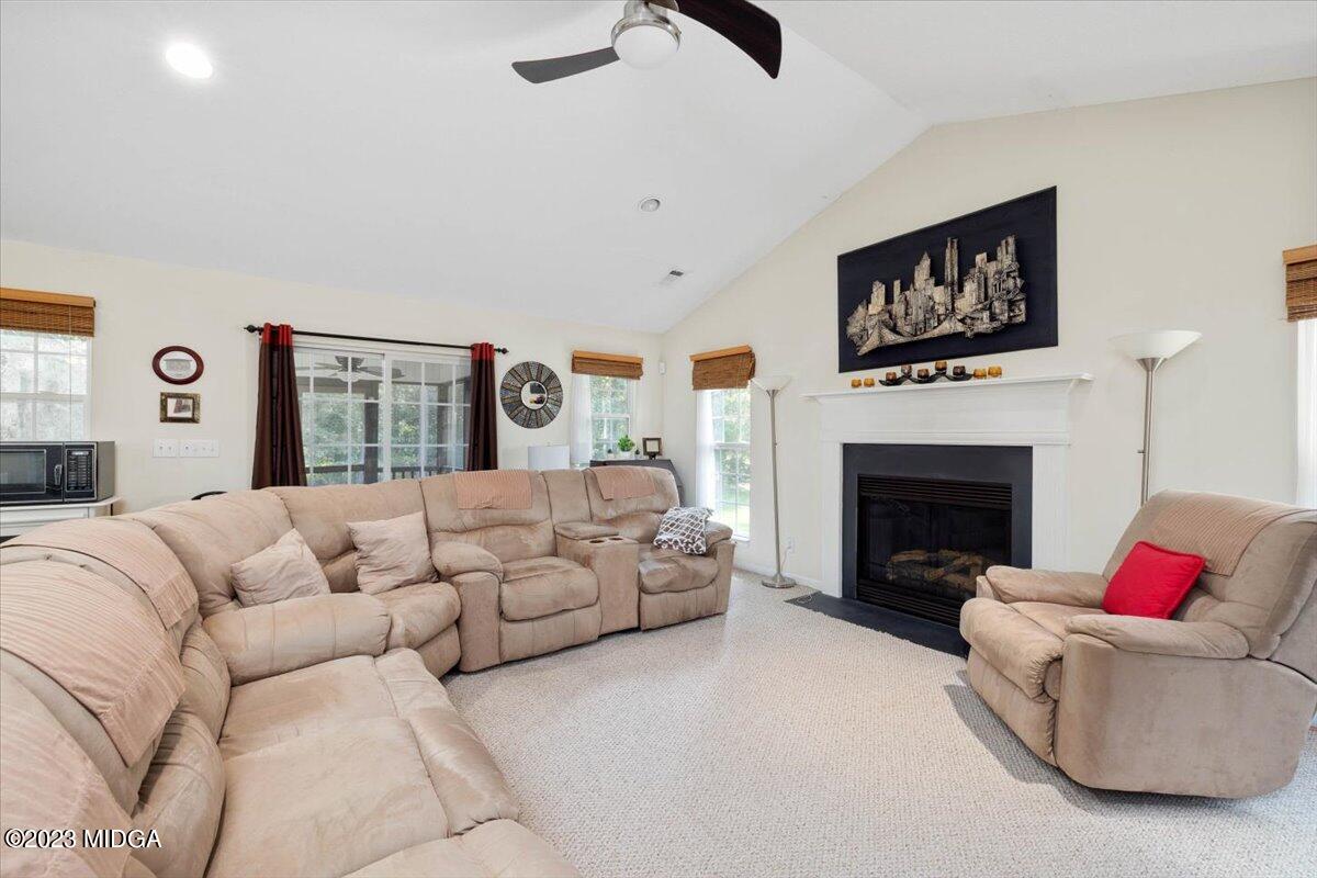 239 Altman Road Gray, GA 31032 - Photo 11 of 46 a living room with furniture and a fireplace