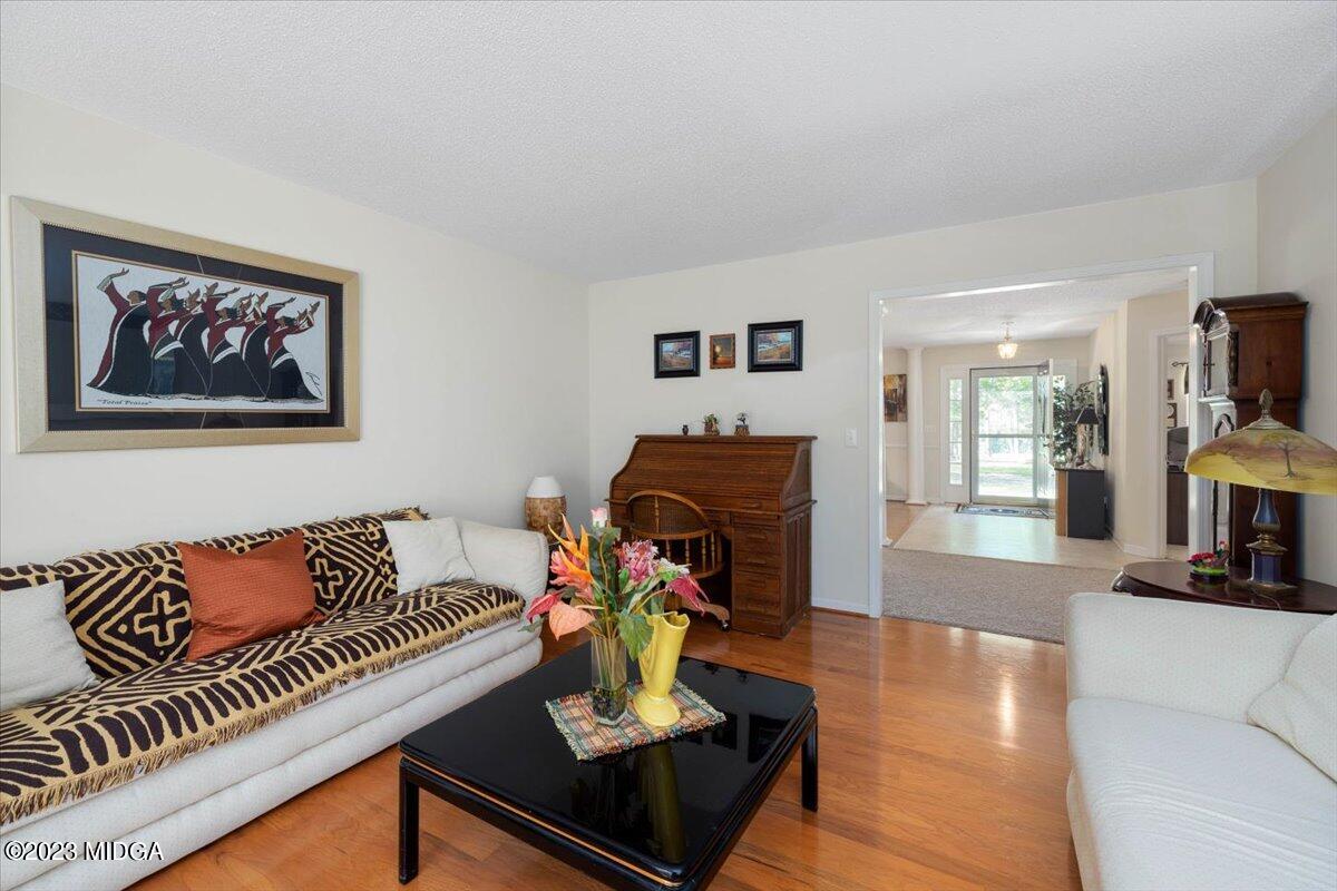 239 Altman Road Gray, GA 31032 - Photo 14 of 46 a living room with furniture and a flat screen tv