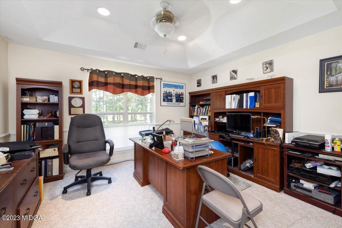239 Altman Road Gray, GA 31032 - Photo 15 of 46 a work room with furniture and a flat screen tv