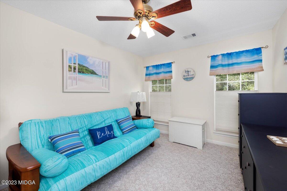 239 Altman Road Gray, GA 31032 - Photo 17 of 46 a living room with furniture and a window