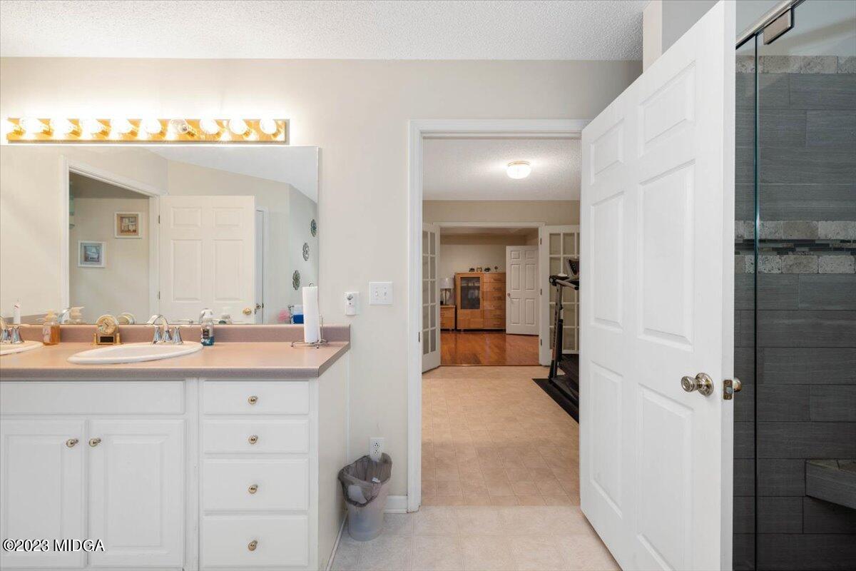 239 Altman Road Gray, GA 31032 - Photo 21 of 46 a en suite bathroom with a sink and a mirror