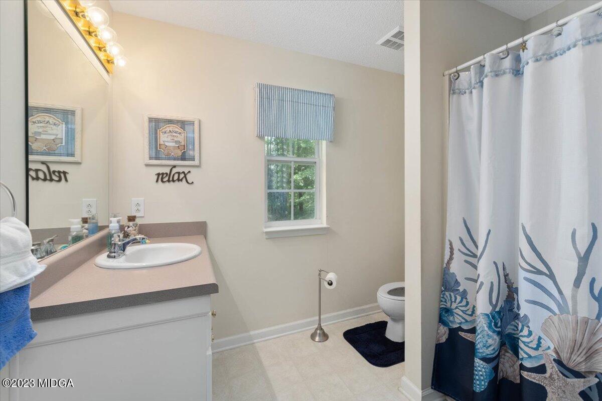 239 Altman Road Gray, GA 31032 - Photo 22 of 46 a bathroom with a sink toilet and shower
