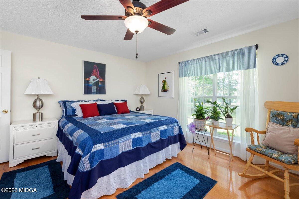 239 Altman Road Gray, GA 31032 - Photo 23 of 46 a bedroom with a bed and a table