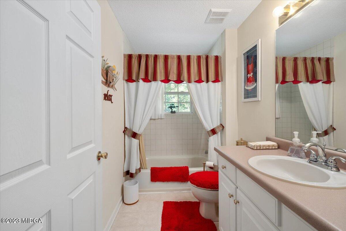 239 Altman Road Gray, GA 31032 - Photo 26 of 46 a bathroom with a sink vanity mirror and tub