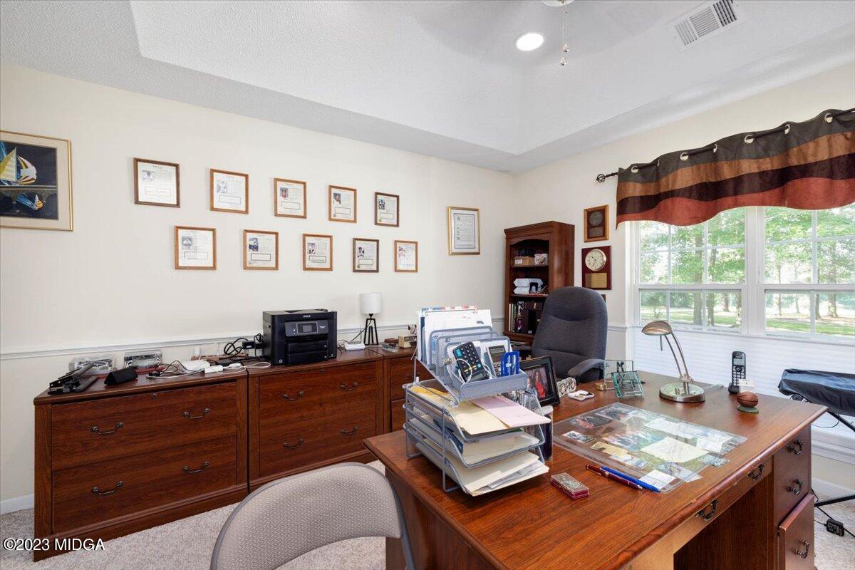 239 Altman Road Gray, GA 31032 - Photo 27 of 46 a living room with furniture and a flat screen tv