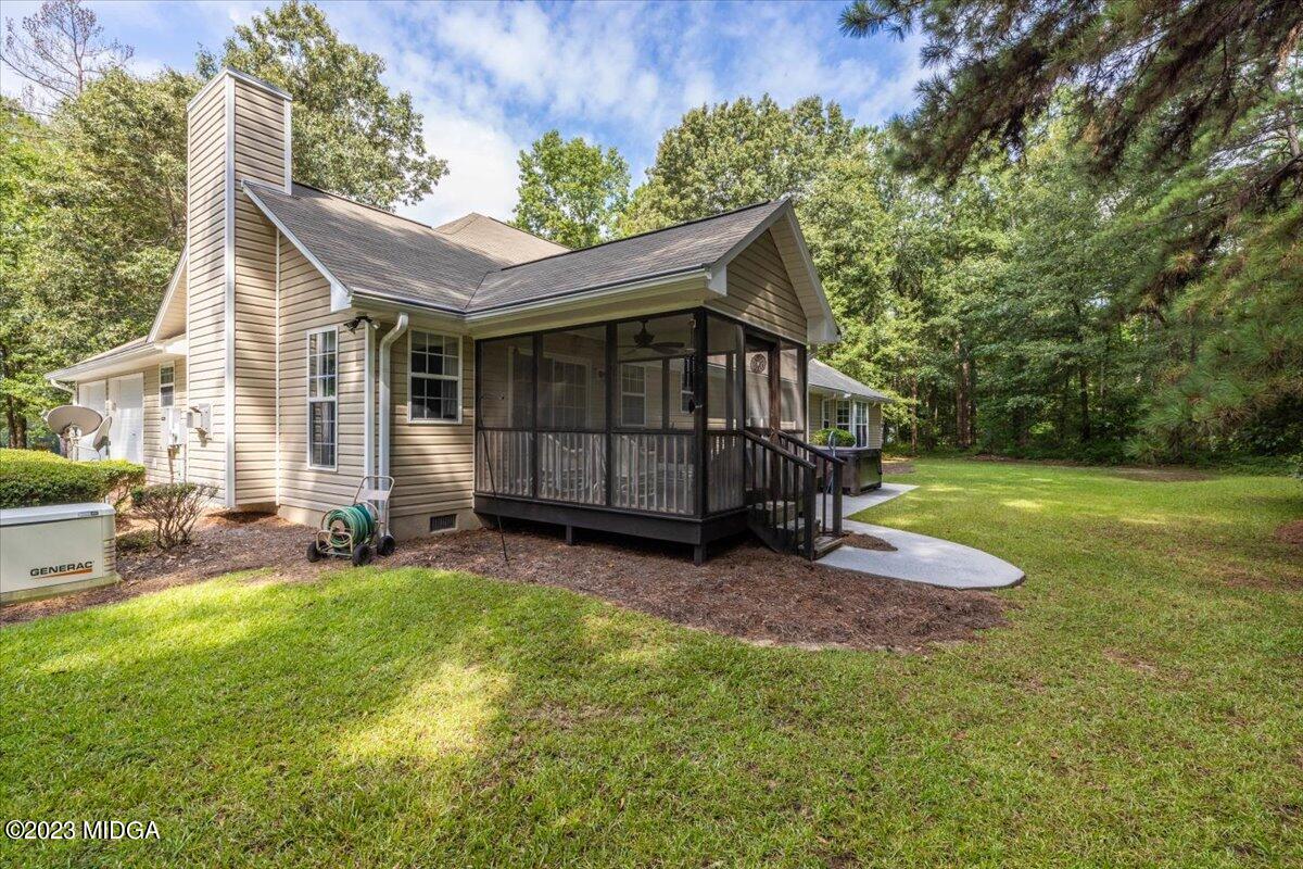 239 Altman Road Gray, GA 31032 - Photo 28 of 46 a view of a house with backyard and sitting area