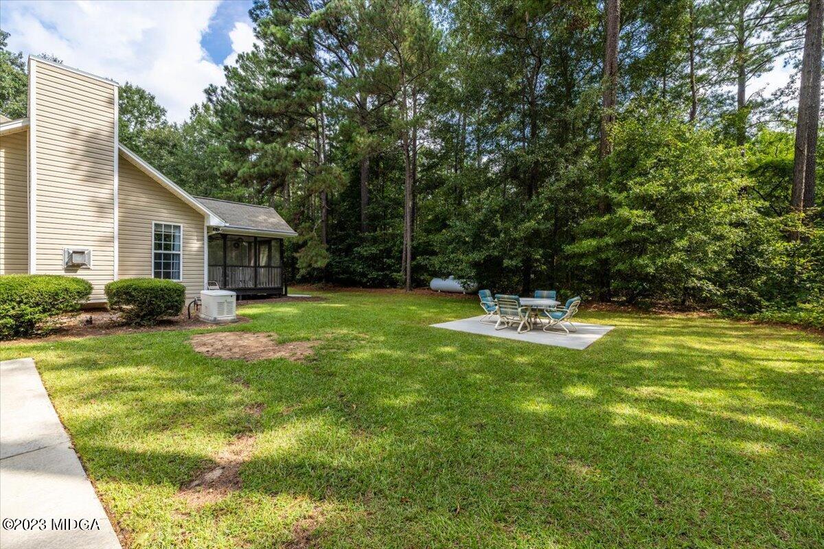 239 Altman Road Gray, GA 31032 - Photo 30 of 46 a house view with swimming pool in front of it