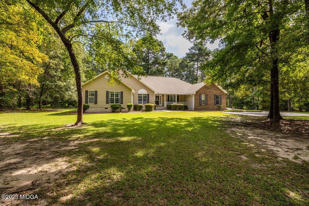 239 Altman Road Gray, GA 31032 - Photo 33 of 46 a view of house with garden and tall trees