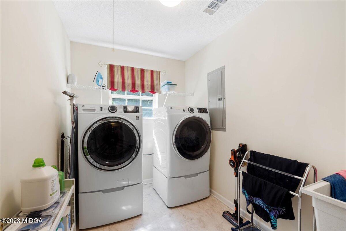 239 Altman Road Gray, GA 31032 - Photo 39 of 46 a living room with furniture and a window