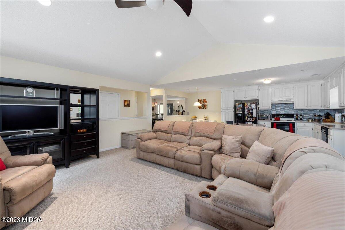 239 Altman Road Gray, GA 31032 - Photo 4 of 46 a living room with furniture and a flat screen tv