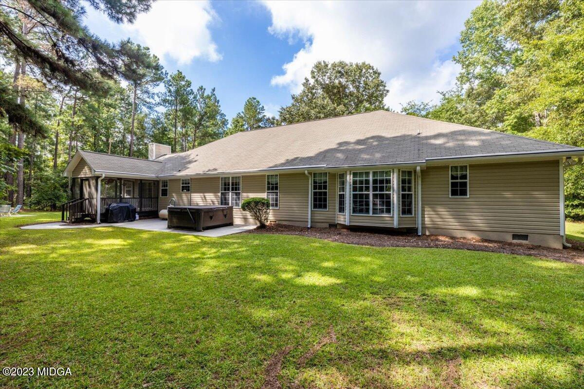 239 Altman Road Gray, GA 31032 - Photo 43 of 46 a front view of a house with a garden