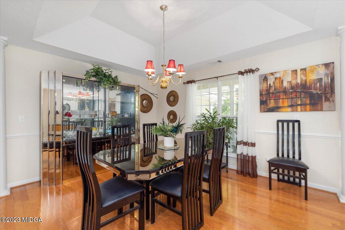 239 Altman Road Gray, GA 31032 - Photo 6 of 46 a view of a dining room with furniture and chandelier