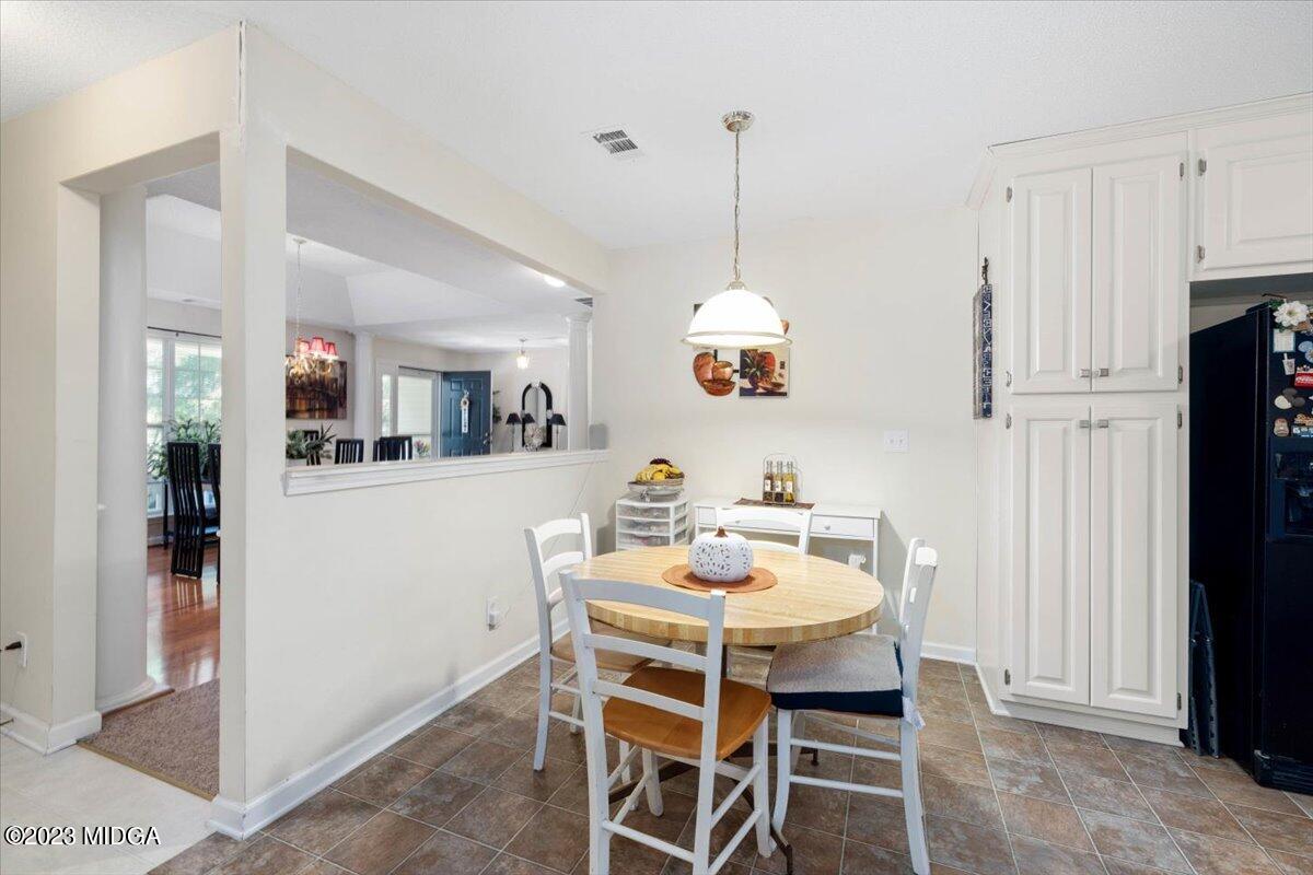 239 Altman Road Gray, GA 31032 - Photo 7 of 46 a dining room with furniture and window