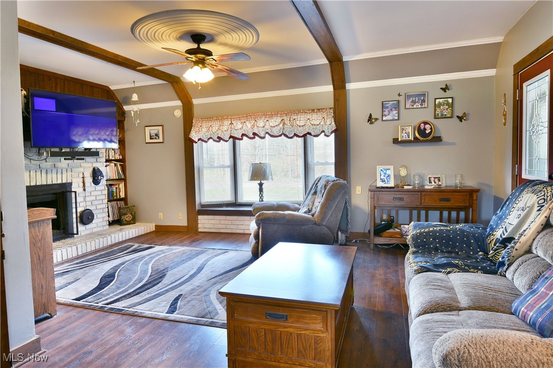 1509 State Road Northwest Warren, OH 44481 - Photo 20 of 49 Living room with dark wood-type flooring, ceiling fan, and plenty of natural light