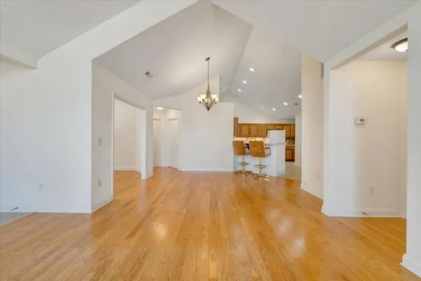 a utility room with cabinets washer and dryer